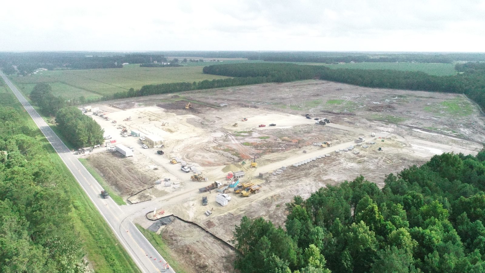 Camden County High School site with grading underway and equipment fleet