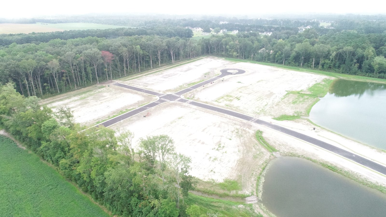 Completed Windswept Pines subdivision with paved roads, cul-de-sacs and stormwater ponds
